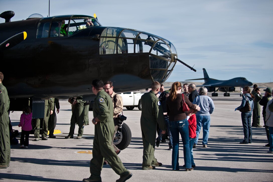 Airmen from Ellsworth Air Force Base and citizens from Rapid City, S.D., turn out to greet “Grumpy” the Historic Flight Foundation’s B-25D Mitchell Bomber alongside of a B-1B Bomber in conjunction with the 70th Anniversary of the Doolittle Raid at Ellsworth Air Force Base, S.D., April 20, 2012. The base’s three current flying squadrons – the 34th Bomb Squadron “Thunderbirds”, 37th Bomb Squadron “Tigers”, and the 432nd Attack Squadron – each have a historic tie to the famous Doolittle Raid. (U.S. Air Force photo by Airman 1st Class Zachary Hada/Released)