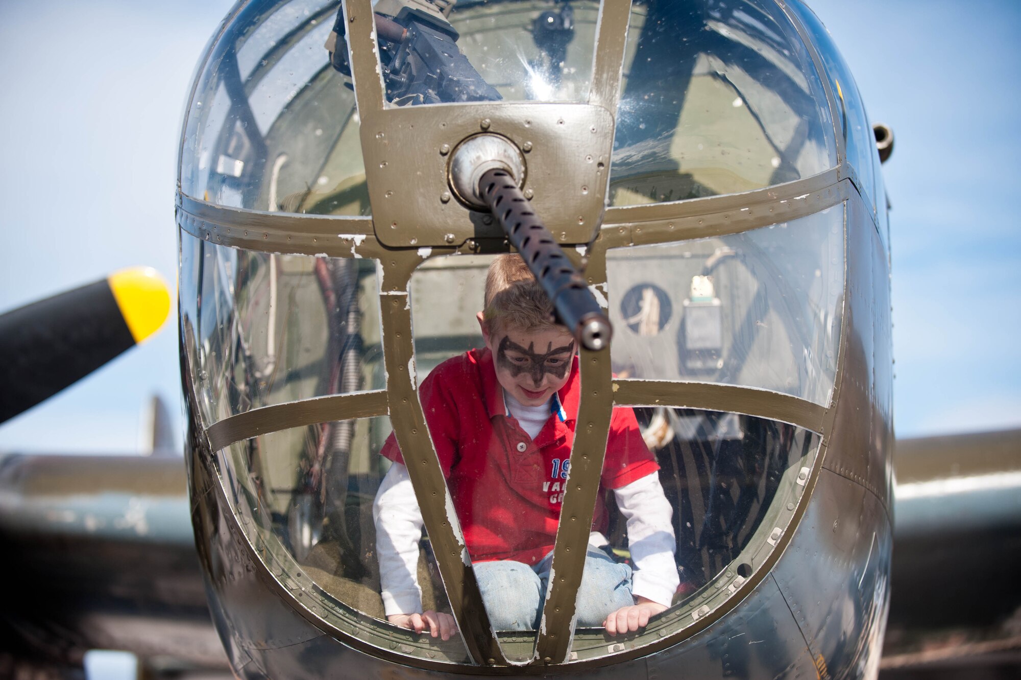 Michael Bunker, son of 1st Lt. Anthony Bunker, 34th Bomb Squadron weapon systems officer, climbs inside of “Grumpy” a B-25D Mitchell Bomber from the Historic Flight Foundation at Ellsworth Air Force Base, S.D., April 20, 2012. Ellsworth hosted “Grumpy” as a static display for Airmen and citizens of Rapid City, S.D., during its return journey for the 70th anniversary of the Doolittle Raid. (U.S. Air Force photo by Airman 1st Class Zachary Hada/Released)