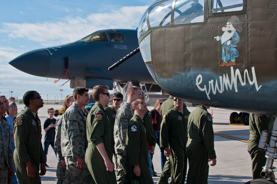 Airmen from Ellsworth Air Force Base and citizens from Rapid City, S.D., turn out to greet the Historic Flight Foundation’s B-25D Mitchell Bomber named “Grumpy” alongside of a B-1B Bomber in conjunction with the 70th Anniversary of the Doolittle Raid at Ellsworth Air Force Base, S.D., April 20, 2012. The base’s three current flying squadrons – the 34th Bomb Squadron “Thunderbirds”, 37th Bomb Squadron “Tigers”, and the 432nd Attack Squadron – each have a historic tie to the famous Doolittle Raid. (U.S. Air Force photo by Airman 1st Class Zachary Hada/Released)