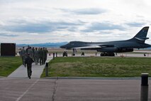 Airmen assemble at the flightline to await the arrival of the Historic Flight Foundation’s B-25D Mitchell Bomber “Grumpy” in conjunction with the 70th anniversary of the famous Doolittle Raid at Ellsworth Air Force Base, S.D., April 20, 2012. The B-25 flew the same route used by the Army Air Corps to deliver aircraft during World War II for its return journey to Snohomish County Airport north of Seattle, Wash. (U.S. Air Force photo by Airman 1st Class Zachary Hada/Released)