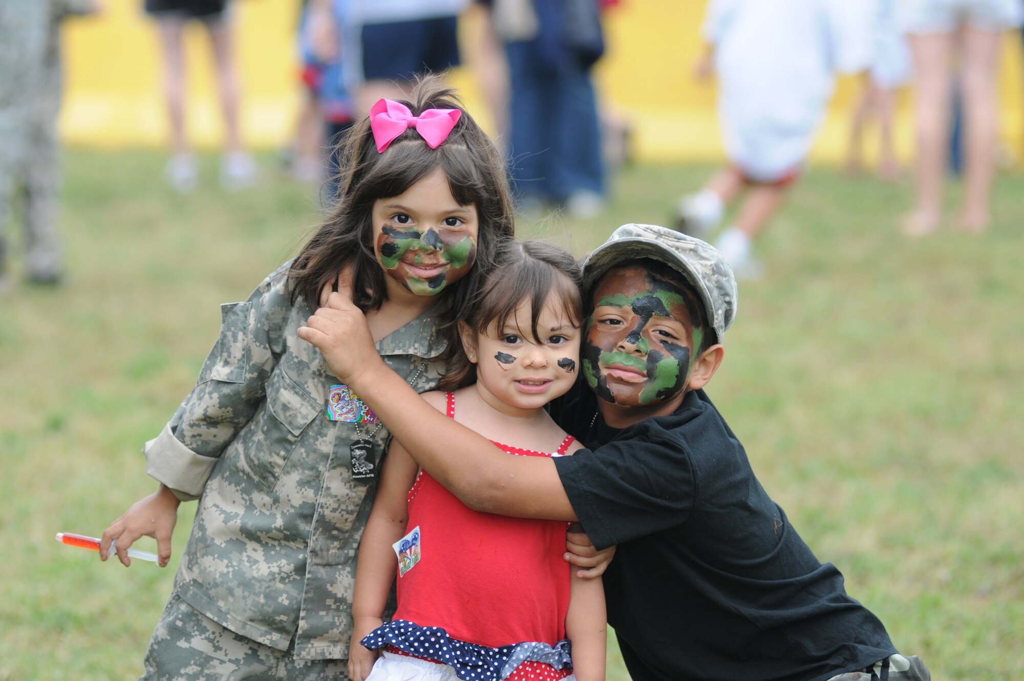 Layliani, 4, Xiomara, 2, and Juan Sanchez, 6, show off their painted faces during Operation Hero April 21, 2012, at Keesler Air Force Base, Miss.  Operation Hero takes place twice a year.  The event was designed to help children better understand what a deployment is and what happens when their parents deploy. Their parents are Cindey and Officer Juan Sanchez, 81st Security Forces Squadron.  Juan is also a sergeant in the Army Reserves at MacDill, Air Force Base, Fla. (U.S. Air Force photo by Kemberly Groue)