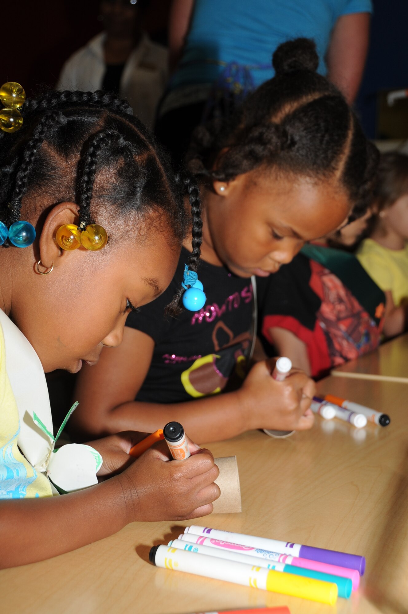 Five-year-olds Nylah Stembridge and Aniyah Chapman decorate their kazoos during a Keesler 4-H Cloverbuds meeting April 17, 2012, at the Child Development Center, Keesler Air Force Base, Miss.  The Keesler 4-H Cloverbuds program is an interactive curriculum-based program designed for 5-6 year olds.  The group meets twice a month while attending the CDC.  Nylah is the daughter of Staff Sgt. David Lee Morgan Jr., 81st Logistics Readiness Squadron.   Aniyah is the daughter of Veronica Chapman, 81st Force Support Squadron.  (U.S. Air Force photo by Kemberly Groue)