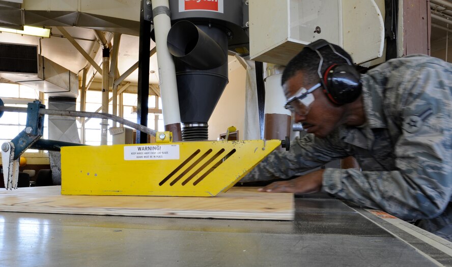 Airman 1st Class Clinton Pearson, 2nd Civil Engineer Squadron structures shop, cuts a piece of plywood for base support on Barksdale Air Force Base, La., April 24. 2 CES structures shop Airmen have a wide variety of skills including woodwork, masonry and metalwork. (U.S. Air Force photo/Airman 1st Class Benjamin Gonsier)(RELEASED)