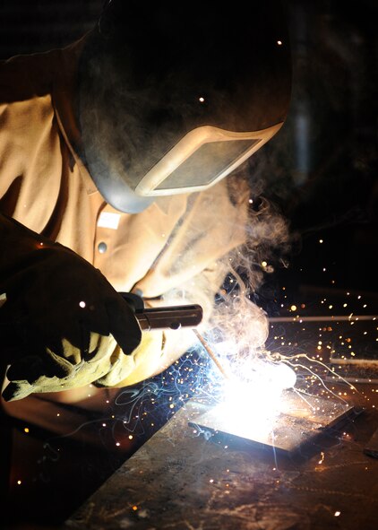 Airman 1st Class Tevin Tolver, 2nd Civil Engineer Squadron structures shop, welds two pieces of metal together during on-the-job training on Barksdale Air Force Base, La., April 24. One task the structures shop takes on is the repairing of all objects made out of metal including door knobs, hinges, pipes and other objects used on base. (U.S. Air Force photo/Airman 1st Class Benjamin Gonsier)(RELEASED)