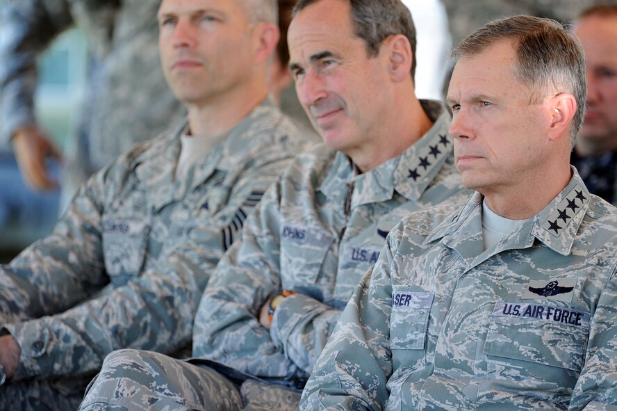 U.S. Air Force Gen. William M. Fraser III, right, commander of U.S. Transportation Command, and Gen. Raymond E. Johns Jr., middle, commander of Air Mobility Command, listen to a briefing before watching two C-130s release eight Joint Precision Airdrop System (JPADS) bundles during a training exercise, April 24, at the Antelope Drop Zone at Fort Hood, Texas. The joint exercise was conducted by the Air Force's 317th Airlift Group, responsible for flying the C-130s, and the National Guard's 294th Quartermaster Company, responsible for packing, rigging and loading the bundles onto the aircraft. (Photo by Daniel Cernero, III Corps and Fort Hood Public Affairs) 


