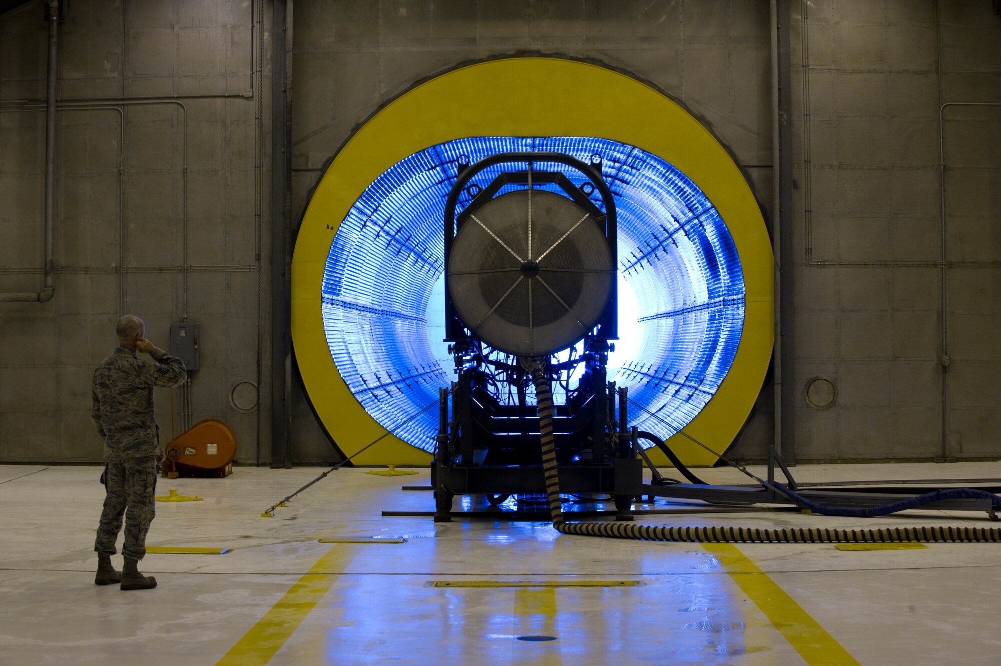 HOLLOMAN AIR FORCE BASE, N.M. – Tech. Sgt. Alan Woodall, 44th Aircraft Maintenance Squadron crew chief, examines an F119-PW-100 jet engine April 19. Woodall was given the chance to see the way jet engines are tested first-hand because as a crew chief, he deals with jet engines on a daily basis. The F119-PW-100 jet engine is the primary propulsion system for the F-22 Raptor. (U.S. Air Force photo by Airman 1st Class Michael A. Shoemaker/Released)