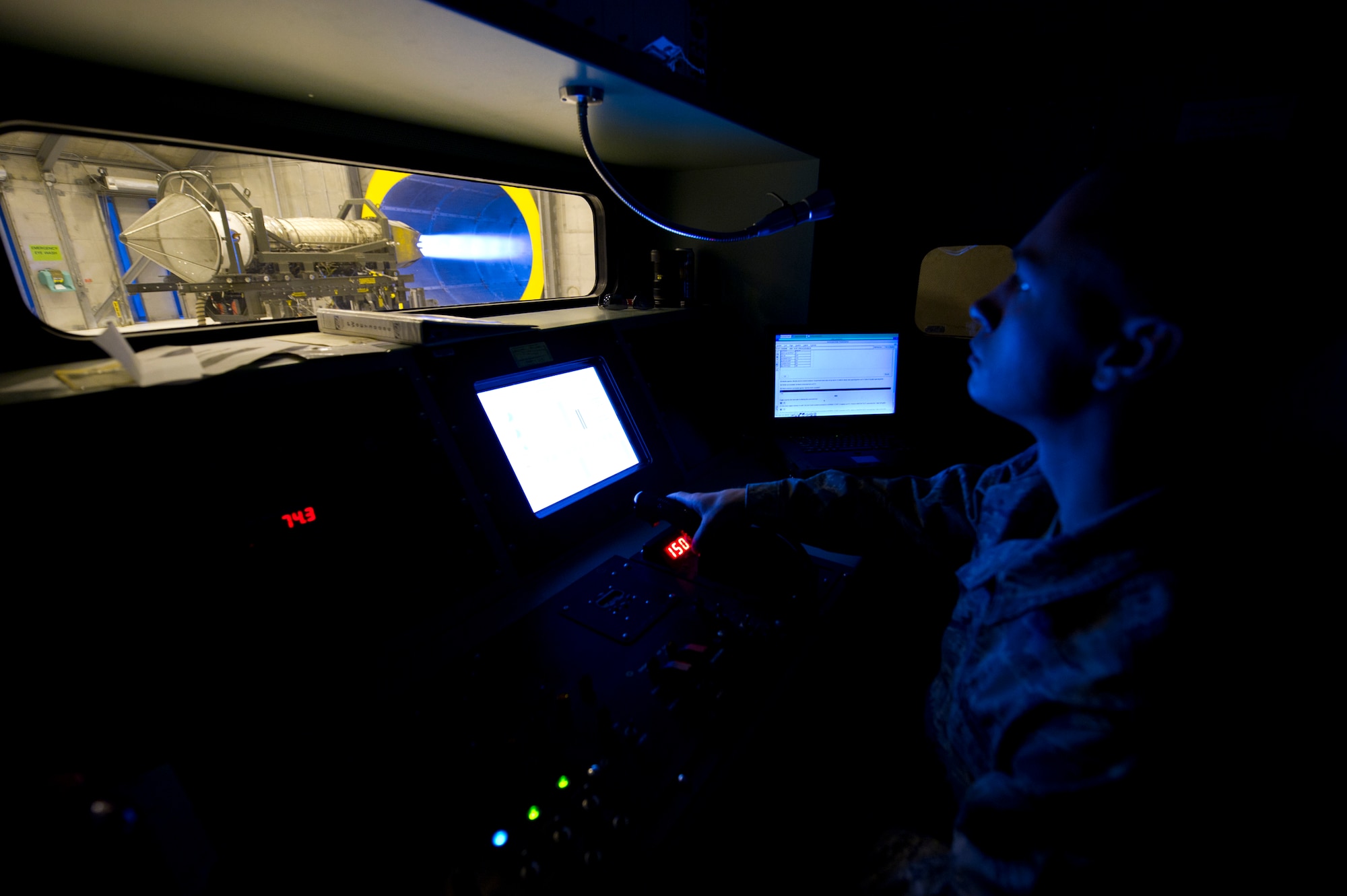 HOLLOMAN AIR FORCE BASE, N.M. – Staff Sgt. Michael Welch, 49th Maintenance Squadron propulsion and flight technician, tests an F119-PW-100 jet engine from within an M37 test stand of a run cab April 19. The run cab allows for safe portable control of an engine test. (U.S. Air Force photo by Airman 1st Class Michael A. Shoemaker/Released)