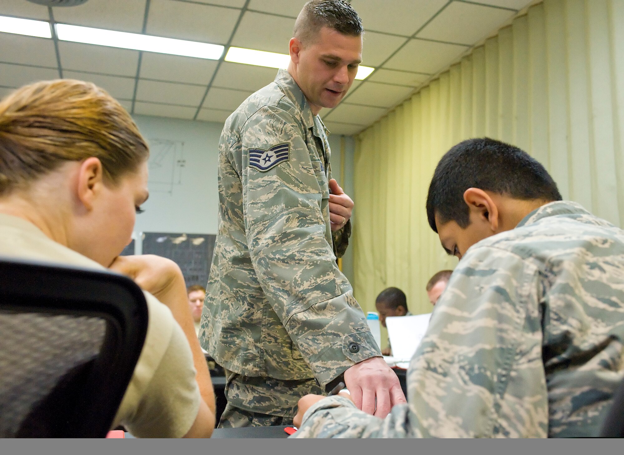 Staff Sgt. Christopher Butler, a C-5 Galaxy crew chief instructor with the 373rd Training Squadron, instructs student C-5 crew chiefs April 20, 2012, at Dover Air Force Base, Del. Butler was named the 2011 Crew Chief of the Year for the 436th Maintenance Group.
