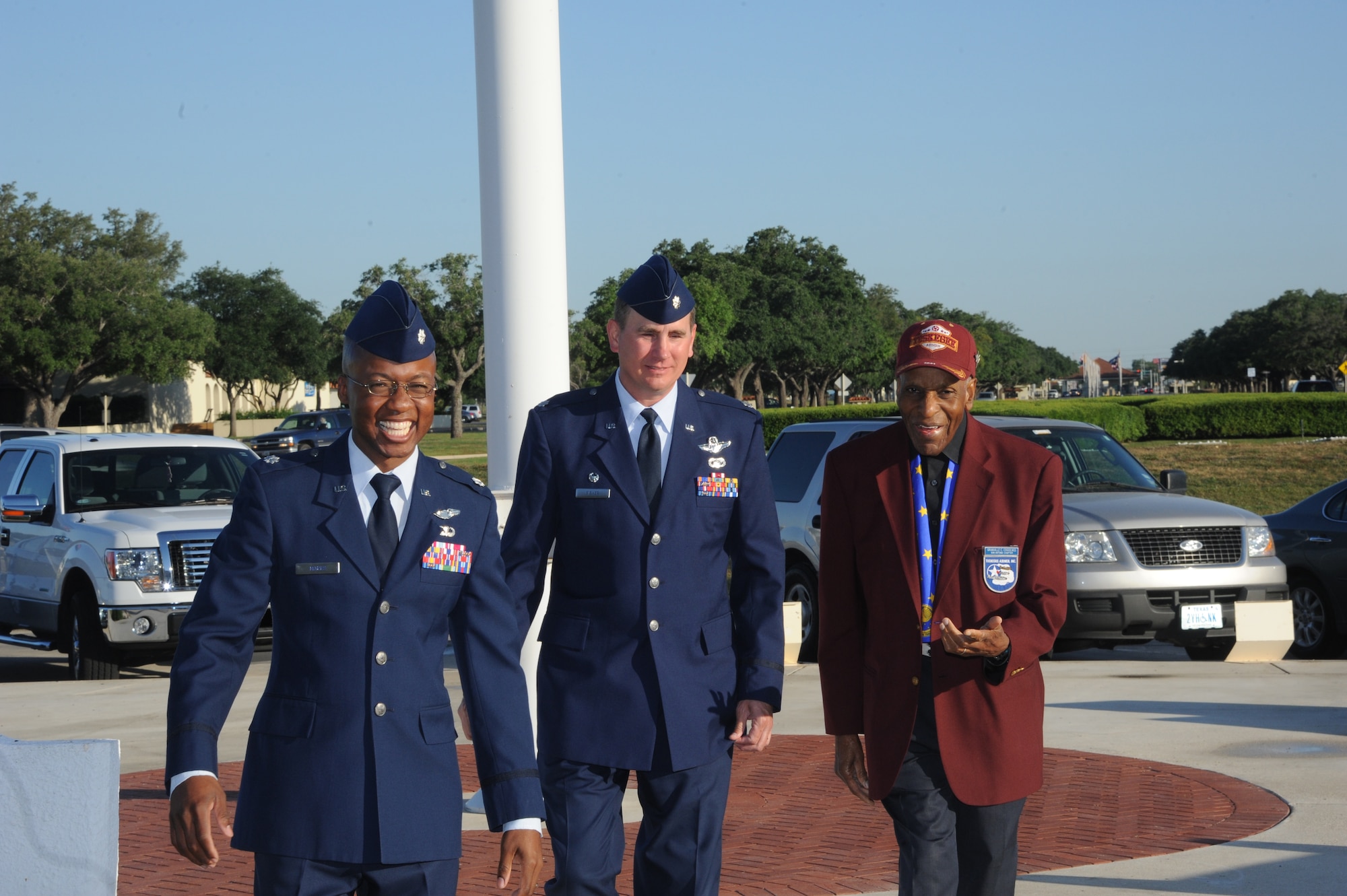 Lt. Col. Gavin Marks (left), 99th Flying Training Squadron director of operations, and Lt. Col. James Fisher, 99th FTS commander, greet Dr. Granville Coggs, Tuskegee Airman, as he arrives at the Taj Mahal Monday for the Tuskegee Heritage Breakfast. The 99th FlyingTraining Squadron's fourth annual Tuskegee Heritage Breakfast paid tribute to the legacy of the segregated fighter group that fought fascism abroad and racism at home during World War II. (U.S. Air Force photo/Rich McFadden) 