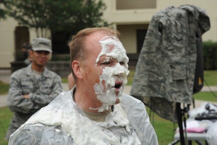 Col. Scott Peel, 902nd Mission Support Group commander, stands with pie on his face as part of a Joint Base San Antonio-Randolph Dorm Community Council Pie-in-the-Face cookout April 20. Peel as well as other base leaders and Airmen were nominated and pied at the event. (U.S. Air Force photo/Rich McFadden) 