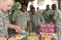 Airmen fill their plates at the Joint Base San Antonio-Randolph Dorm Community Council's Pie-in-the-Face cookout April 20. The Randolph First Sergeant's Council sponsored and cooked for the lunch-time event. (U.S. Air Force photo/Rich McFadden) 