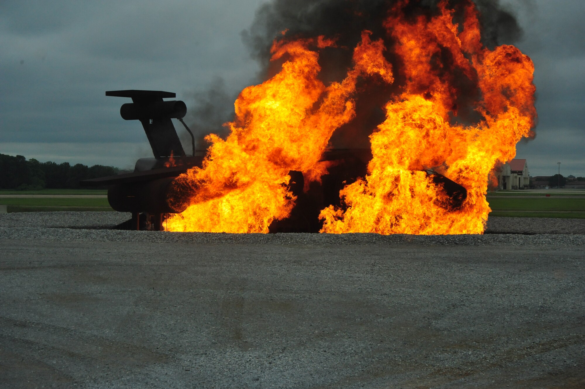 A simulated aircraft is ignited to begin a training exercise at Maxwell Air Force Base on April 19. The flames are switched on and off manually to ensure the situation is handled properly. (Air Force photo by Airman 1st Class William Blankenship)