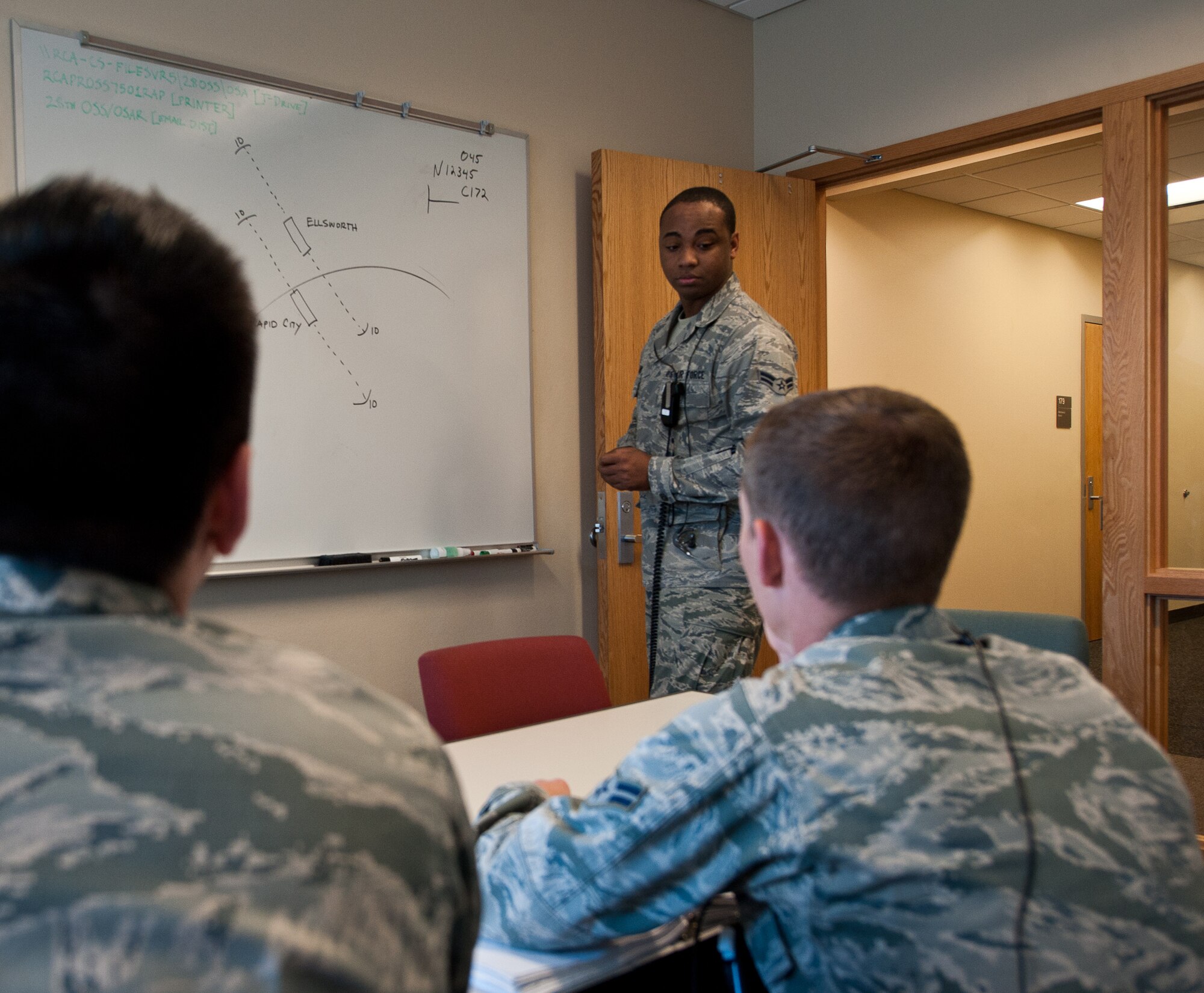 Airman 1st Class Rodreakius Edwards, 28th Operations Support Squadron air traffic control technician, teaches Airmen about visual flight rules during a training session at Ellsworth Air Force Base, S.D., April 19, 2012. The 28th OSS Radar Approach Control section controls the airspace for Ellsworth, Rapid City Regional Airport, and aircraft operating around Minot AFB, N.D. (U.S. Air Force photo by Airman 1st Class Alystria Maurer/Released)