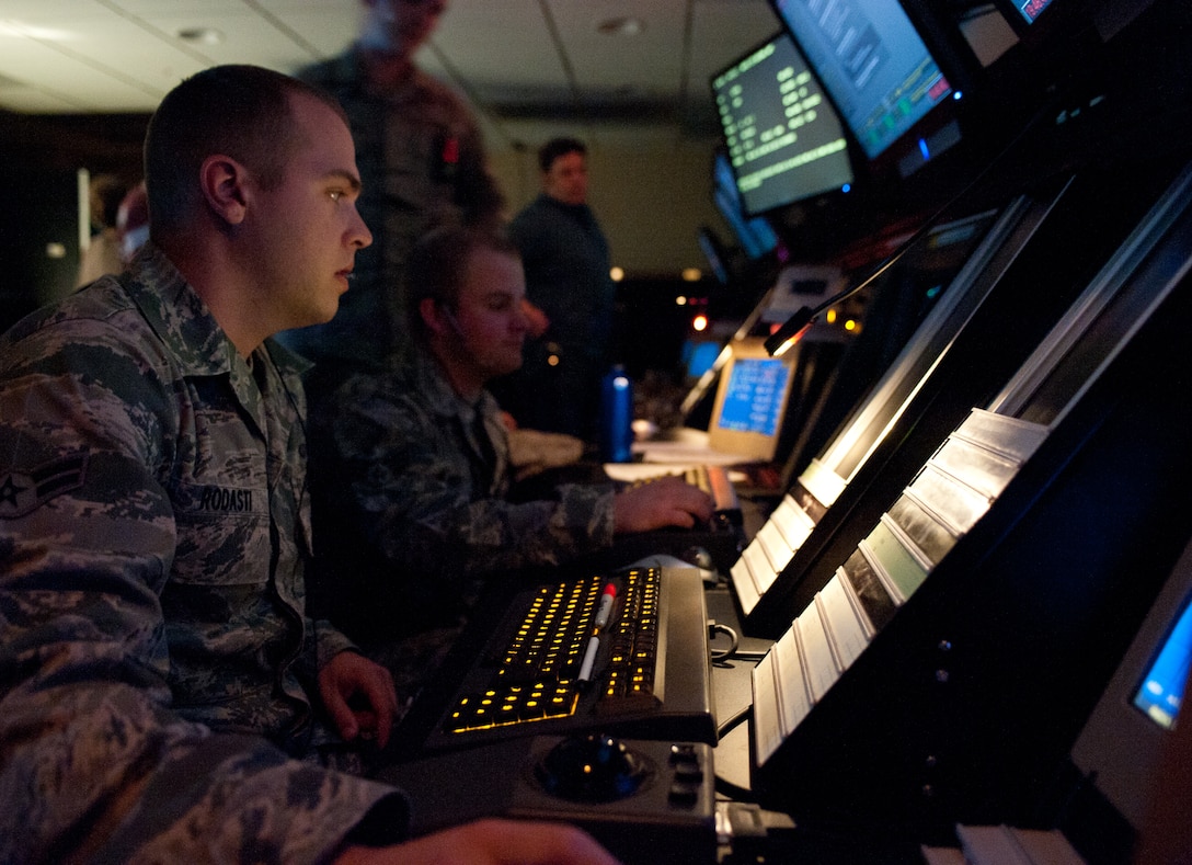 Airman 1st Class Sean Rodasti, 28th Operations Support Squadron air traffic control technician, confers with a B-1 bomber aircrew operating in airspace around Ellsworth Air Force Base, S.D., April 19, 2012. 28th OSS Radar Approach Control section controls the airspace for North and South Dakota, including all civilian and military aircraft. (U.S. Air Force photo by Airman 1st Class Alystria Maurer/Released)