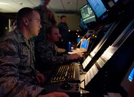 Airman 1st Class Sean Rodasti, 28th Operations Support Squadron air traffic control technician, confers with a B-1 bomber aircrew operating in airspace around Ellsworth Air Force Base, S.D., April 19, 2012. 28th OSS Radar Approach Control section controls the airspace for North and South Dakota, including all civilian and military aircraft. (U.S. Air Force photo by Airman 1st Class Alystria Maurer/Released)