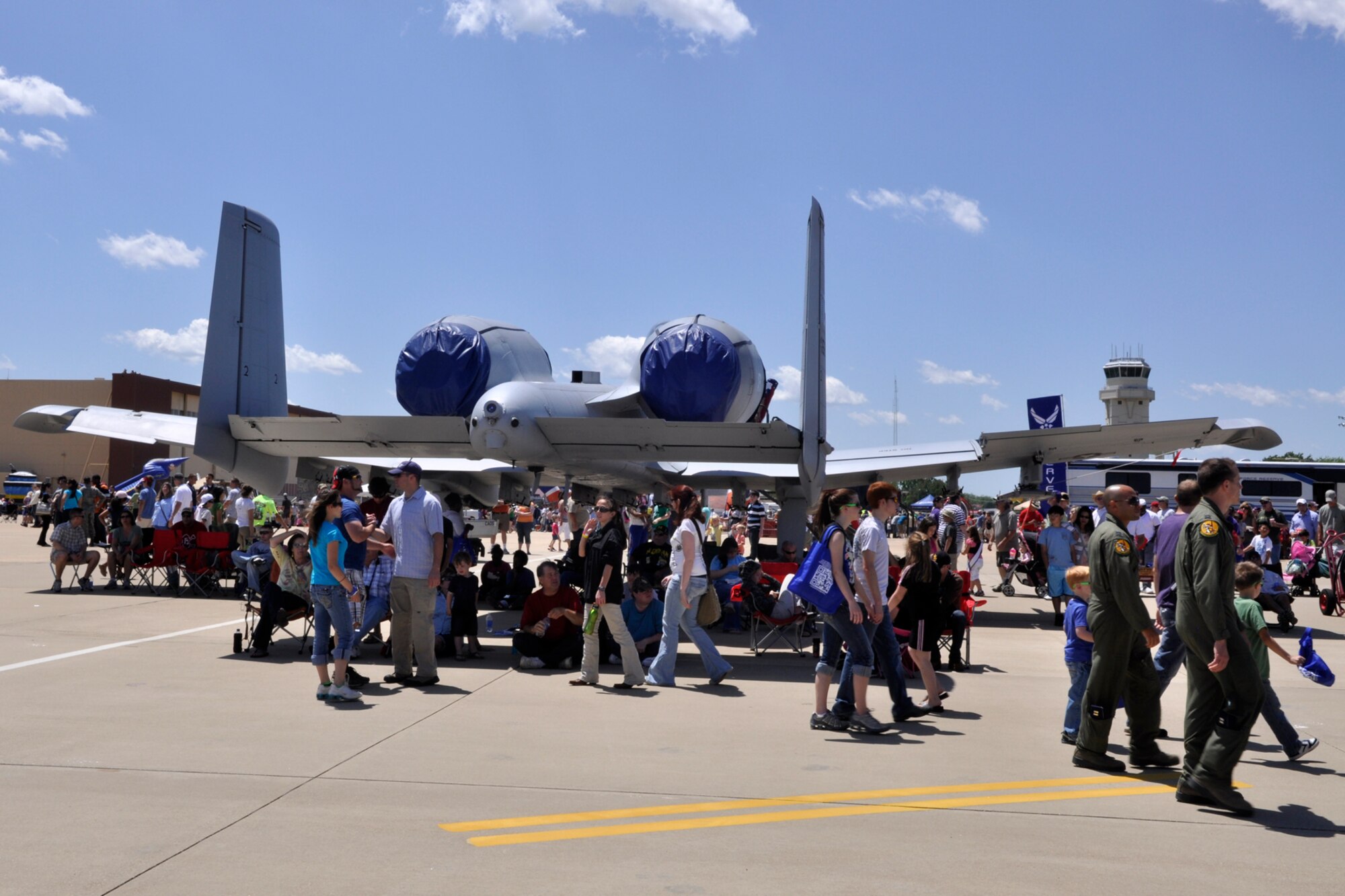 The crowd finds shade under an A-10 Thunderbolt II at the 2012 Defenders of Liberty Air Show at Barksdale Air Force Base, La., April 22, 2012. The Warthog as it is affectionately known, has excellent maneuverability at low air speeds and altitude, and is a highly accurate weapons-delivery platform. Both the 307th Bomb Wing and 917th Fighter Group provided static displays for the air show. (U.S. Air Force photo by Master Sgt. Jeff Walston)