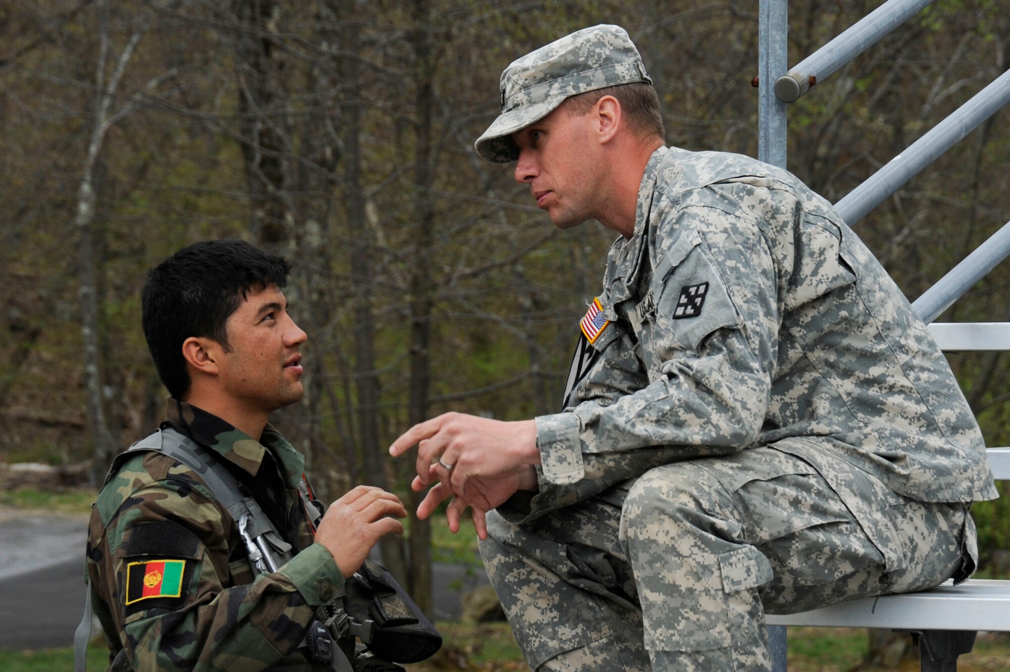 An Afghan cadet consults with his host nation adviser at the U.S. Military Academy April 18, 2012, in West Point, N.Y. Cadets from military academies and colleges from around the world were invited to participate in the 2012 Sandhurst Competition. The competition was designed to promote excellence among cadets. (U.S. Air Force photo/Tech. Sgt. Mareshah Haynes)