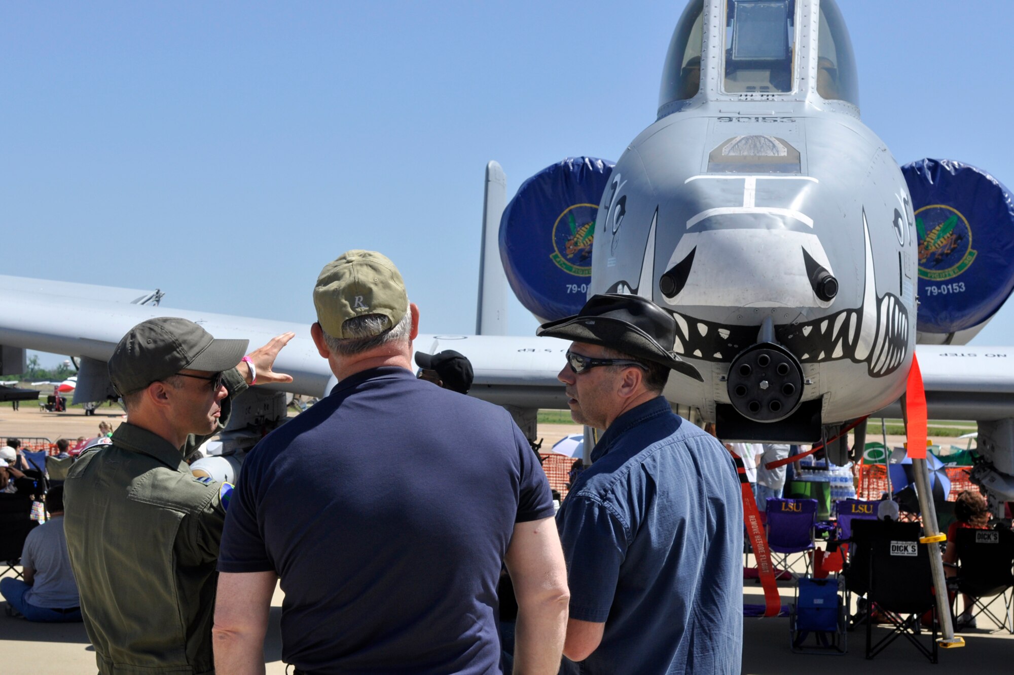 Capt. Jeff Negrette, an A-10 Thunderbolt II pilot assigned to the 47th Fighter Squadron, briefs visitors at the 2012 Defenders of Liberty Air Show about the seven-barrel 30mm Gatling gun on the A-10 at Barksdale Air Force Base, La., April 22, 2012. Both the 307th Bomb Wing and 917th Fighter Group provided static displays for the air show. (U.S. Air Force photo by Master Sgt. Jeff Walston)