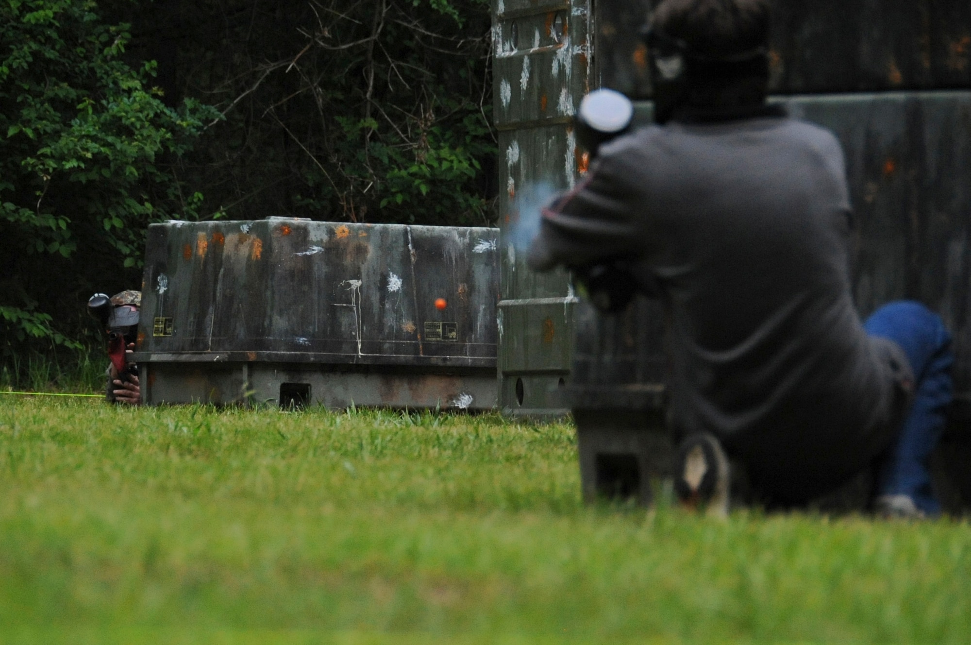 A paintball player fires a round at an opposing player on Barksdale Air Force Base, La., April 15. In the past, on-base paintball courses were managed by Outdoor Recreation, but as of April 7, Splat Zone entered a contract with the base to manage and maintain the paintball fields.  (U.S. Air Force photo/Airman 1st Class Micaiah Anthony)(RELEASED)