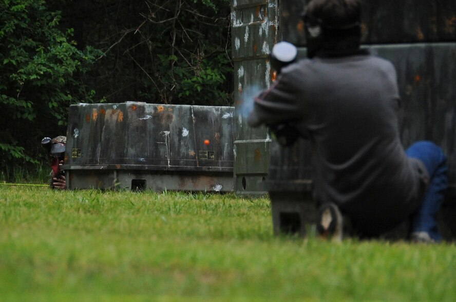 A paintball player fires a round at an opposing player on Barksdale Air Force Base, La., April 15. In the past, on-base paintball courses were managed by Outdoor Recreation, but as of April 7, Splat Zone entered a contract with the base to manage and maintain the paintball fields.  (U.S. Air Force photo/Airman 1st Class Micaiah Anthony)(RELEASED)