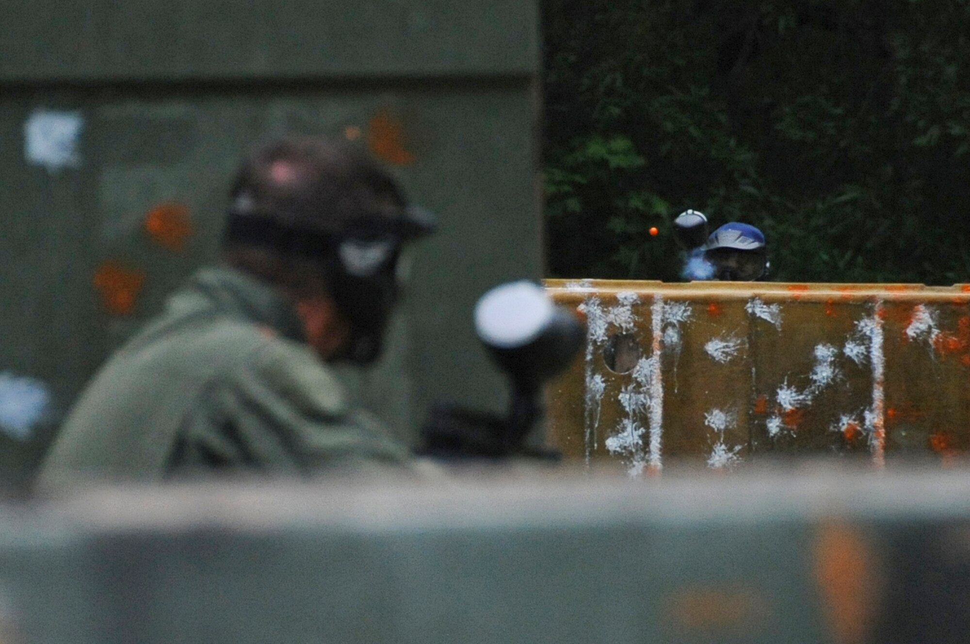 A paintball player fires a round at an opposing player on Barksdale Air Force Base, La., April 15. As of April 7, the paintball fields will be open Saturdays and Sundays from 9 a.m. until one hour before dusk.  The field fee for military members and their dependents on Saturday is $10 and is free on Sundays. Non-military members must pay a field fee of $15 on Saturday and $10 on Sunday. The field fee covers all equipment excluding paintballs which must be purchased separately. (U.S. Air Force photo/Airman 1st Class Micaiah Anthony)(RELEASED)
