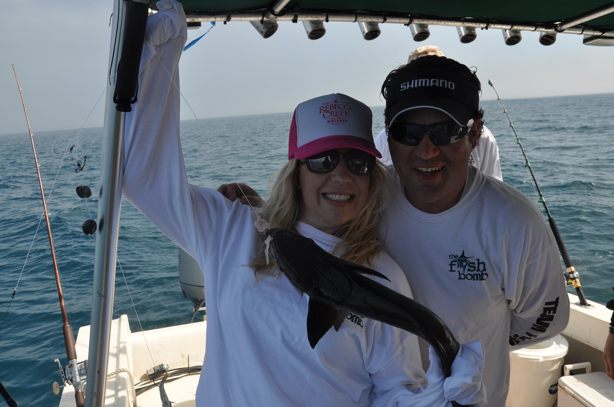 Staff Sgt. Brittnie Baxter, 53rd Weapons Evaluation Group knowledge operations manager, posed for a picture with Rusty Pease, Warriors Roadtrip Network president and founder, with a remora she caught off the coast of Panama City, Fla. March 14, 2012. (U.S. Air Force photo by Airman 1st Class Christopher Reel)