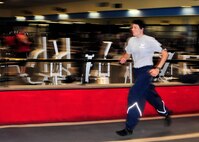 Members of the 914th Airlift Wing perform their annual physical fitness testing at a local fitness center on April 24, 2012, Amherst, NY. Due to inclement weather and high winds the testing was done on the clubs indoor track. (U.S. Air Force photograph by Tech. Sgt. Joseph McKee)
