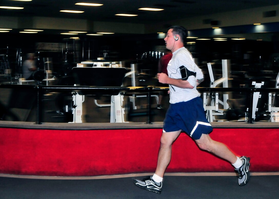 Members of the 914th Airlift Wing perform their annual physical fitness testing at a local fitness center on April 24, 2012, Amherst, NY. Due to inclement weather and high winds the testing was done on the clubs indoor track. (U.S. Air Force photograph by Tech. Sgt. Joseph McKee)