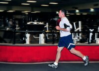 Members of the 914th Airlift Wing perform their annual physical fitness testing at a local fitness center on April 24, 2012, Amherst, NY. Due to inclement weather and high winds the testing was done on the clubs indoor track. (U.S. Air Force photograph by Tech. Sgt. Joseph McKee)