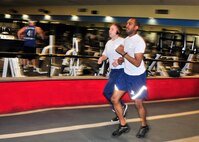 Members of the 914th Airlift Wing perform their annual physical fitness testing at a local fitness center on April 24, 2012, Amherst, NY. Due to inclement weather and high winds the testing was done on the clubs indoor track. (U.S. Air Force photograph by Tech. Sgt. Joseph McKee)