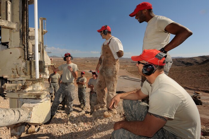 U.S. Air Force Airman from the 820th RED HORSE Squadron train Airman from the 823rd and 201st RED HORSE Squadrons on how to use a rock drill, April 17, 2012, at Nellis Air Force Base, Nev. The knowledge gained during this class will help the Airman prepare for upcoming deployments.  (U.S. Air Force photo by Staff Sgt. William P.Coleman)  