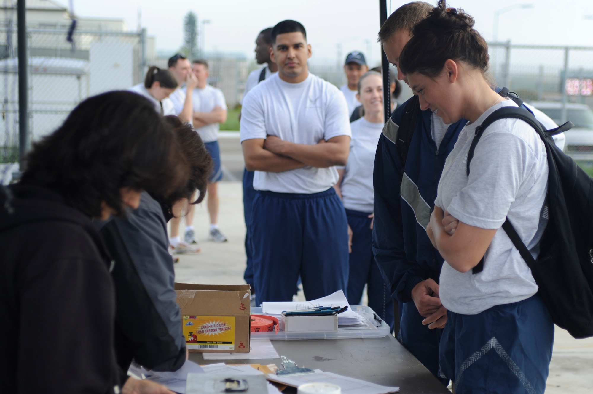 VANDENBERG AIR FORCE BASE, Calif. -- Team V members sign up to volunteer during the Northern Santa Barbara County Special Olympics event at Pioneer Valley High School, Santa Maria Saturday, April 21, 2012. Team V members have volunteered with the Northern Santa Barbara County Special Olympics for more than 30 years. More than 145 base volunteers from 19 organizations participated in the event this year. (U.S. Air Force photo/Staff Sgt. Andrew Satran) 

 