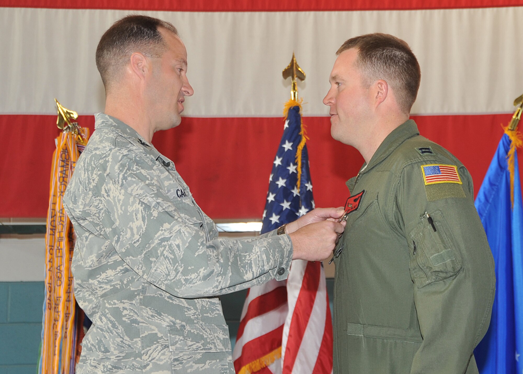 KIRTLAND AFB, N.M. -- Capt. Christopher Palmer, 512th Rescue Squadron, was presented the Distinguished Flying Cross by Col. James Cardoso, 58th Special Operations Wing commander, during a ceremony here April 20. Palmer received the medal for flying two mass-casualty evacuation missions in Afghanistan in 2010. The medal is awarded to servicemembers who distinguish themselves by heroism or extraordinary achievement while participating in an aerial flight in support of operations. (Photo by Todd Berenger)