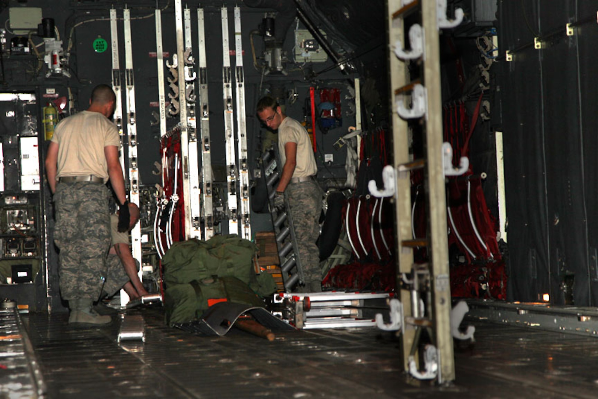Military members from the 911th Maintenance Squadron place rollers in the
floor of an Air Force Active Duty C-130H2 Hercules cargo compartment, April
23, 2012, in support of the isochronal inspection being performed here.
Cargo rollers allow for fast and easy handling of cargo pallets, but can be
removed to maintain a flat surface. The rear ramp of the aircraft can also
be lowered to make loading and unloading of personnel, cargo and vehicles
easier. The aircraft was received from Little Rock AFB, Ark., April 9.  The
inspection is expected to take 18 days. (U.S. Air Force photo by Tech. Sgt.
Ralph Van Houtem/ Released)
