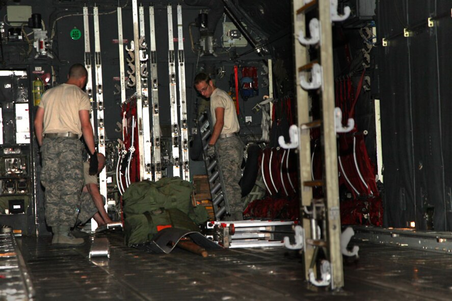 Military members from the 911th Maintenance Squadron place rollers in the
floor of an Air Force Active Duty C-130H2 Hercules cargo compartment, April
23, 2012, in support of the isochronal inspection being performed here.
Cargo rollers allow for fast and easy handling of cargo pallets, but can be
removed to maintain a flat surface. The rear ramp of the aircraft can also
be lowered to make loading and unloading of personnel, cargo and vehicles
easier. The aircraft was received from Little Rock AFB, Ark., April 9.  The
inspection is expected to take 18 days. (U.S. Air Force photo by Tech. Sgt.
Ralph Van Houtem/ Released)
