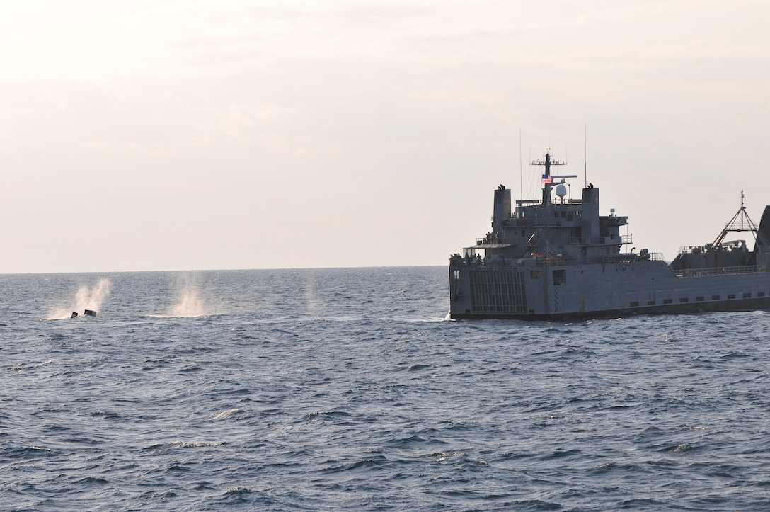 Soldiers from the 703rd Brigade Support Battalion, 4th Brigade Combat Team, 3rd Infantry Division fire the M-2 .50 caliber machine gun from the aft section of the Logistical Support Vessel 1 “Gen. Frank S. Besson Jr.” April 12, 2012. (U.S. Army photo by Staff Sgt. Alexander Burnett/Released)