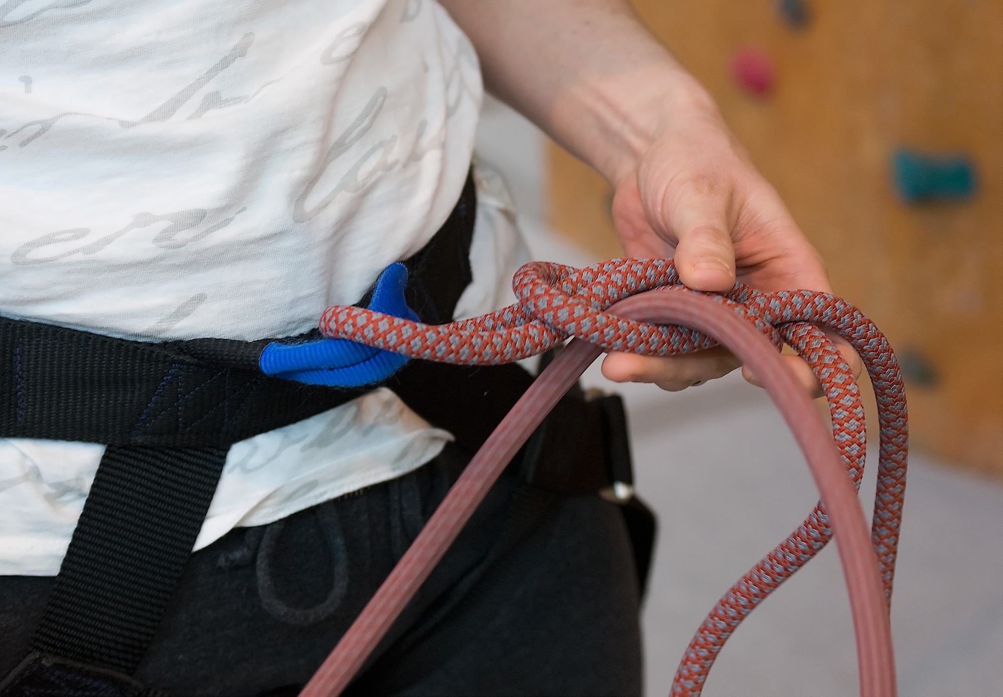 A climber ties a knot into her safety harness while rock climbing at the Outdoor Recreation Center March 29, 2011, at Dover Air Force Base, Del. Safety is a priority while climbing. Classes on how to tie knots and belay are available to all Team Dover Members. (U.S. Air Force photo/Steve Kotecki)