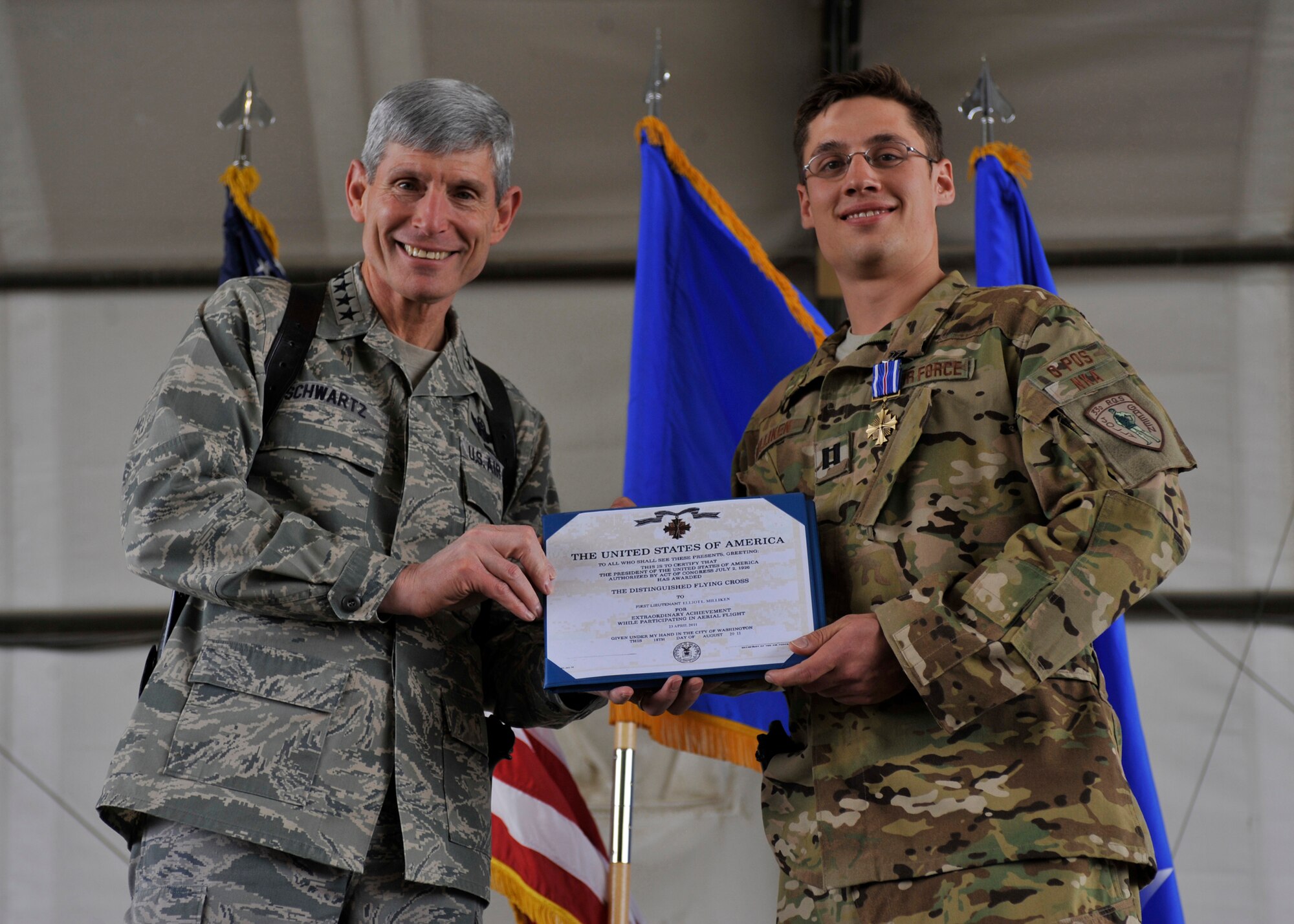 Air Force Chief of Staff Gen. Norton Schwartz awards the Distinguished
Flying Cross to Capt. Elliot Milliken, an HH-60G Pave Hawk pilot, at Bagram
Airfield, Afghanistan, April 23, 2012.  Milliken was awarded the
Distinguished Flying Cross for extraordinary achievement while in aerial
flight. Milliken was copilot of the lead Pave Hawk which rescued two Army pilots downed in enemy controlled territory.  (U.S. Air Force photo/Airman 1st Class Ericka Engblom)
