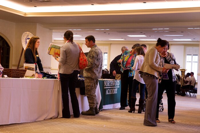 Military members and their families attend the School Choice Showcase at the Club at Joint Base Charleston on April 23. The showcase provided information to JB Charleston families about the educational choices available for their children in the Charleston County area. The event featured musical performances from local school children and informational displays from local schools. (U.S. Air Force photo by Airman 1st Class George Goslin/Released)

