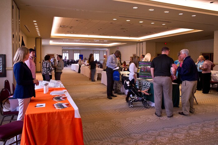 Military members and their families attend the School Choice Showcase at the Club at Joint Base Charleston on April 23. The showcase provided information to JB Charleston families about the educational choices available for their children in the Charleston County area. The event featured musical performances from local school children and informational displays from local schools. (U.S. Air Force photo by Airman 1st Class George Goslin/Released)

