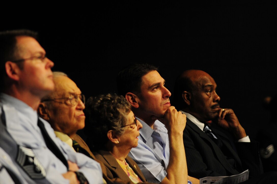 U.S. Air Force Col. Korvin Auch, 633rd Air Base Wing commander, and Chief Master Sgt. Kevin Howell, 633rd ABW command chief, along with Kitty Friedenbach Saks, Holocaust survivor, and her husband, Abbott, watch the keynote presentation during the Joint Base Langley-Eustis Holocaust Remembrance Commemoration at Langley Air Force Base, Va., April 23, 2012.  The United States Congress established the Days of Remembrance, spanning from April 15 to 22, as our nation’s annual commemoration of the Holocaust.  (U.S. Air Force photo by Airman 1st Class Kayla Newman/Released)