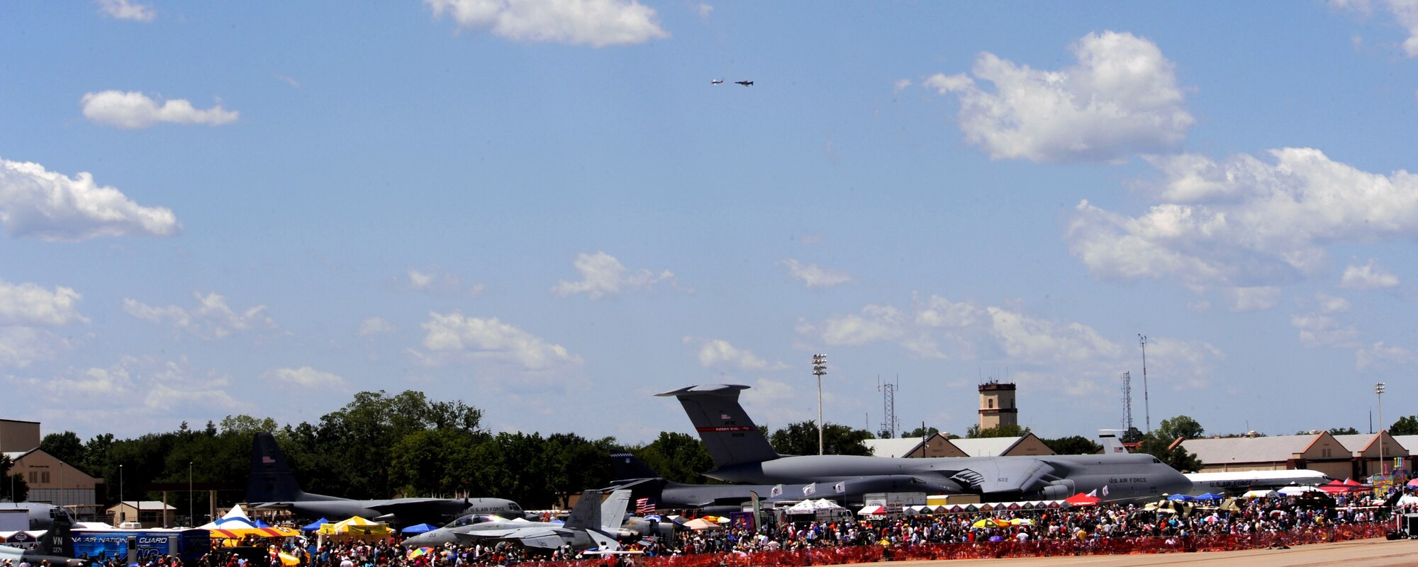 A P-47 Thunderbolt and F-4 Phantom fly together in a Heritage Flight performance during the 2012 Barksdale Air Force Base Defenders of Liberty Air Show April 22. The Heritage Flight offered spectators a rare opportunity to see historic aircraft in formation together. (U.S. Air Force photo/Senior Airman La'Shanette V. Garrett) (RELEASED)
