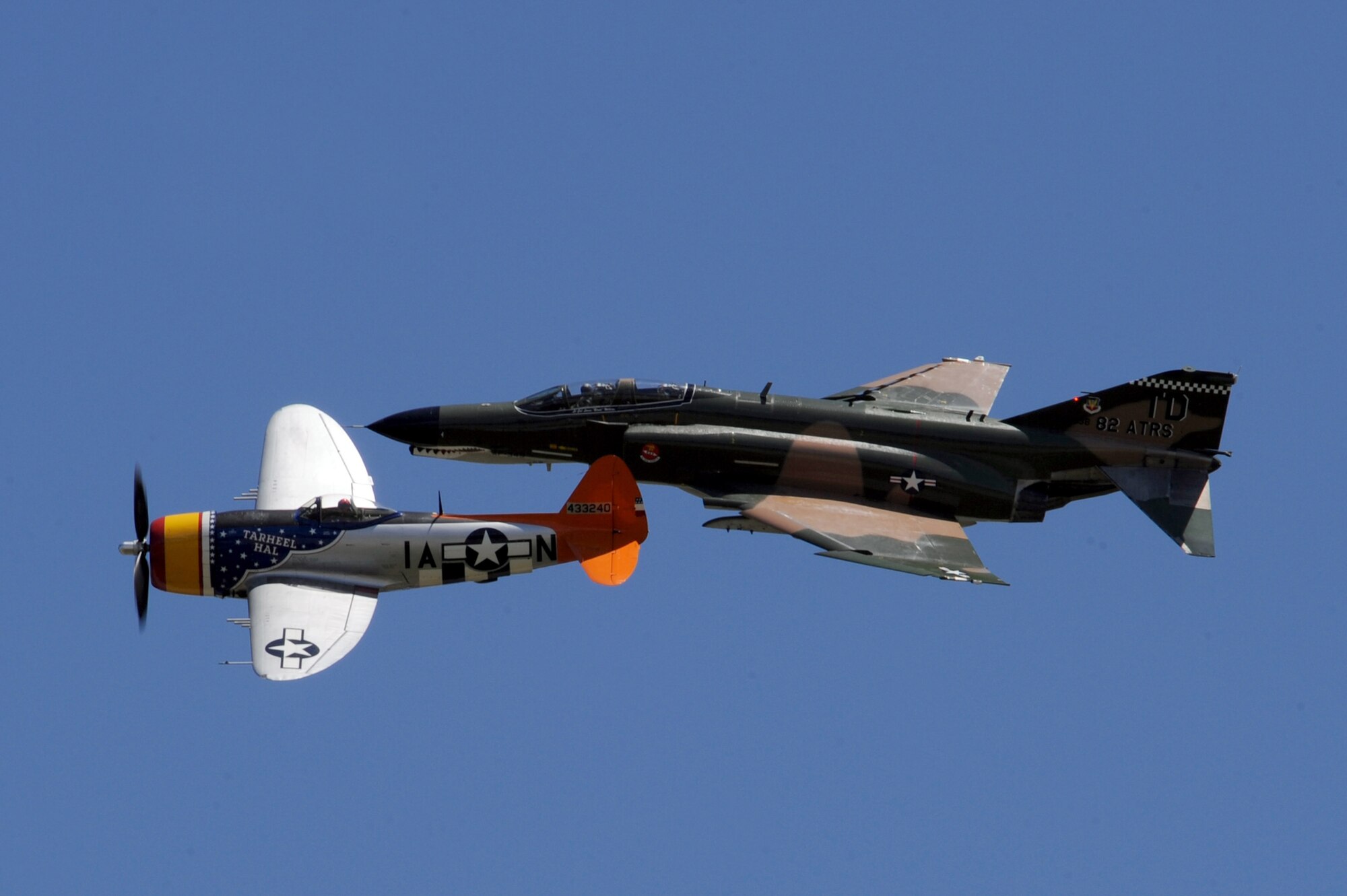 A P-47 Thunderbolt and F-4 Phantom fly together in a Heritage Flight performance during the 2012 Barksdale Air Force Base Defenders of Liberty Air Show April 22. Nicknamed 'Jug,' the P-47 flew its first flight on May 6, 1947 whereas the F-4 made its first flight in May 1958. (U.S. Air Force photo/Senior Airman La'Shanette V. Garrett) (RELEASED)
