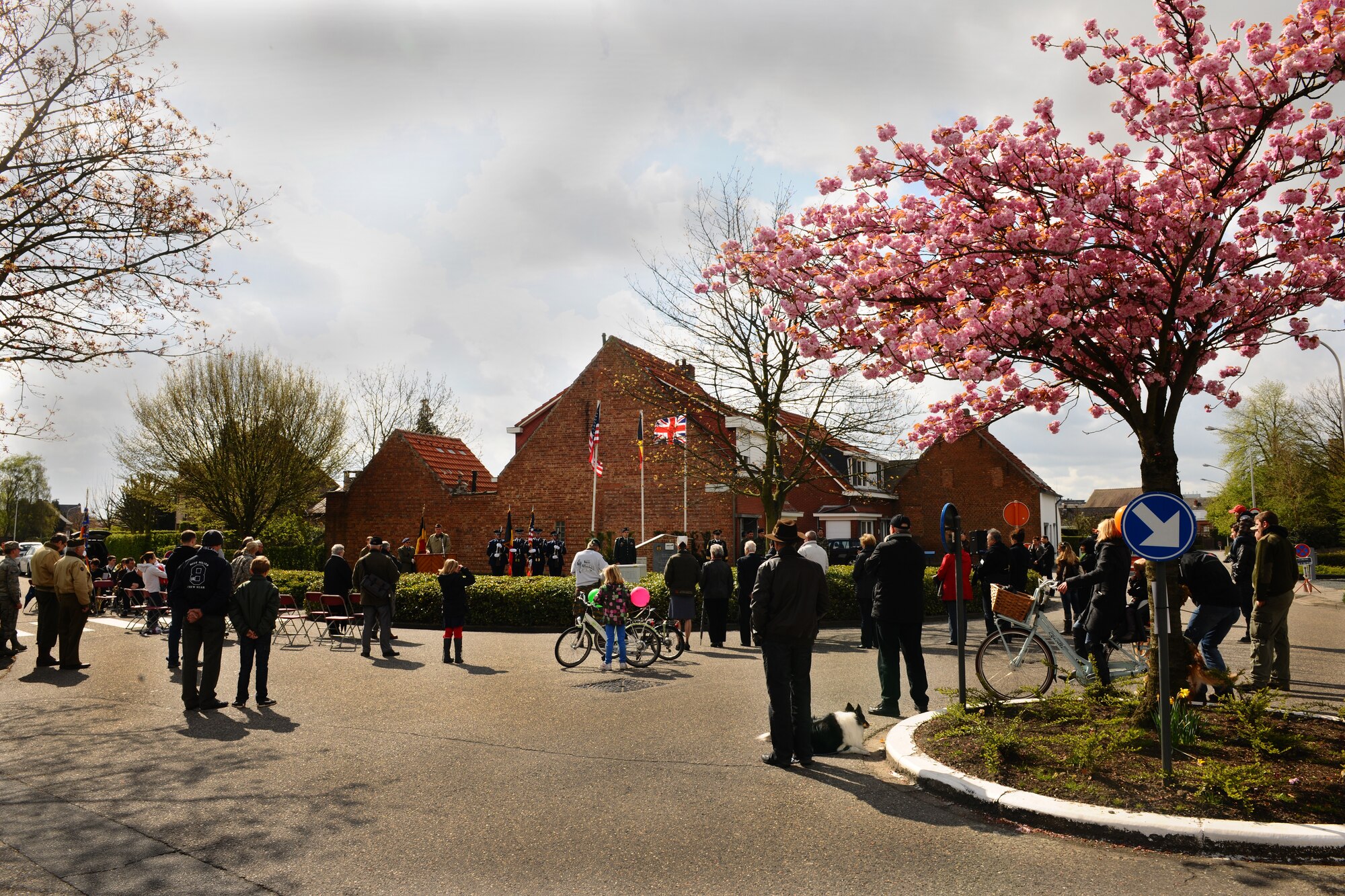 DUFFEL, Belgium – People watch the 52nd Fighter Wing Honor Guard perform ceremonial drills during colors at an annual remembrance ceremony held here April 22. The ceremony is held to remember a B-17G Flying Fortress, Pluto’s Avenger, that crash landed Feb. 22, 1944, in Duffel. People travel to the aircraft-crash site memorial to participate in the ceremony, which honors the four crew members who were killed in action during the crash. The honor guard works to support the local community’s ceremonies by performing at more than 20 memorial and recognition ceremonies each year. (U.S. Air Force photo by Airman 1st Class Dillon Davis/Released)