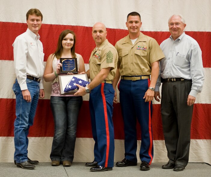 The Frerich family is presented the Military Family of the Year award April, 21, 2012, at the Civic Center in Abilene, Texas. The 47th annual World’s Largest BBQ is sponsored by the Abilene Chamber of Commerce to show appreciation by providing free food to active-duty members, retired military and dependents. (U.S. Air Force photo by Airman 1st Class Jonathan Stefanko/ Released)