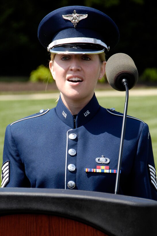 A U.S. Air Force Band vocalist performs the Star Spangled Banner during a ceremony on base. Joint Base Anacostia-Bolling honored those who lost their lives during a Holocaust: Days of Remembrance ceremony at the U.S. Air Force Ceremonial Lawn, April 19, on base. (U.S. Air Force photo by Senior Airman Steele C. G. Britton)
