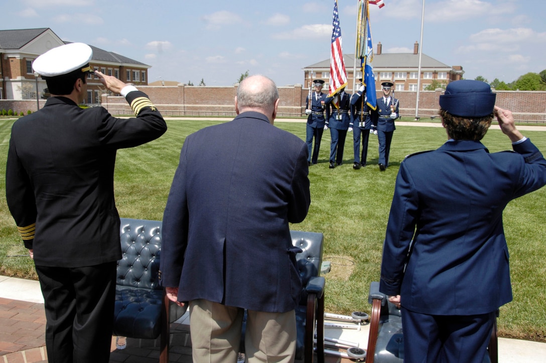 Navy Capt. Anthony T. Calandra, Joint Base Anacostia-Bolling commander, Charles Stein, Holocaust survivor, and Col. Gina Humble, 11th Operations Group commander, salute the colors presented by the U.S. Air Force Honor Guard during a remembrance ceremony. Joint Base Anacostia-Bolling honored those who lost their lives during a Holocaust: Days of Remembrance ceremony at the U.S. Air Force Ceremonial Lawn, April 19, on base. (U.S. Air Force photo by Senior Airman Steele C. G. Britton)
