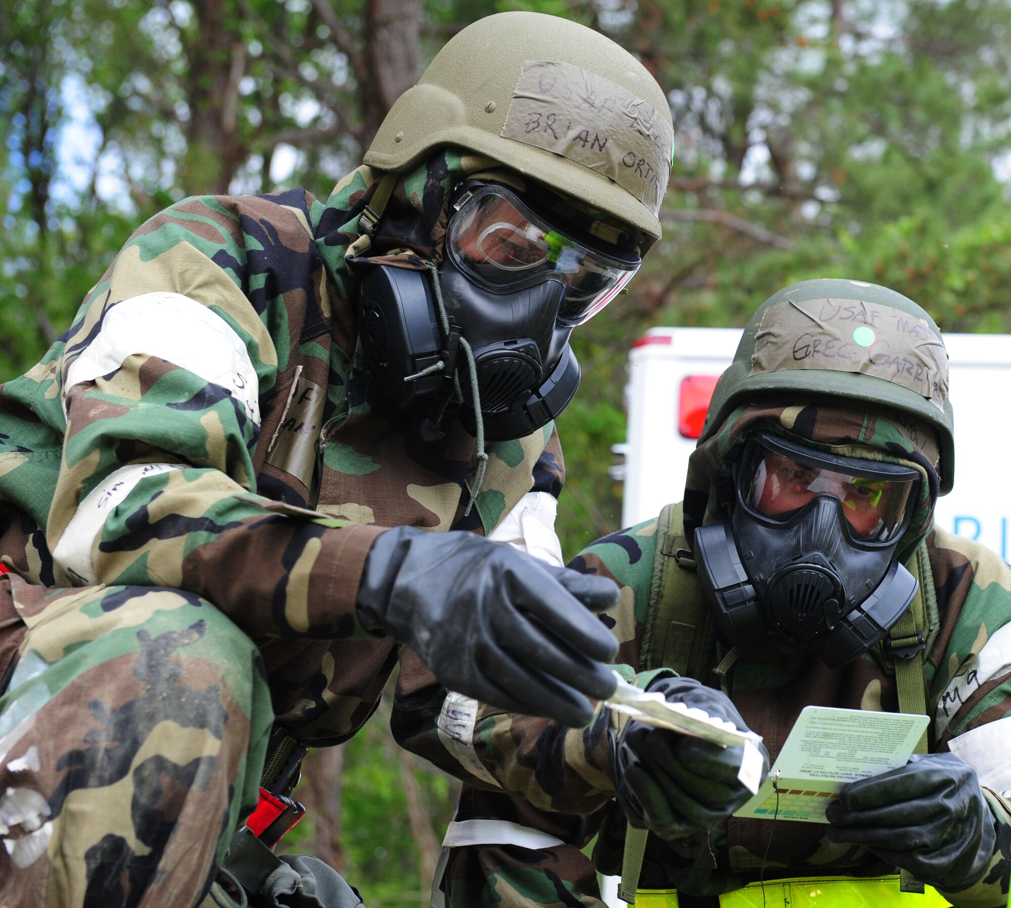 U.S. Air Force Lt. Col. Brian Ortman, left, 1st Fighter Wing Public Health commander, and Maj. Greg Garrison, right, 633rd Aerospace Medicine Squadron Bio-Environmental Engineering Flight commander, perform a post-attack reconnaissance sweep during a Phase II Operational Readiness Exercise at Langley Air Force Base, Va., April 20, 2012.  The Phase II ORE evaluates the unit’s ability to Employ the Force, Sustain the Force, and the Ability to Survive and Operate in a deployed environment.   (U.S. Air Force photo by Airman 1st Class Kayla Newman/Released)