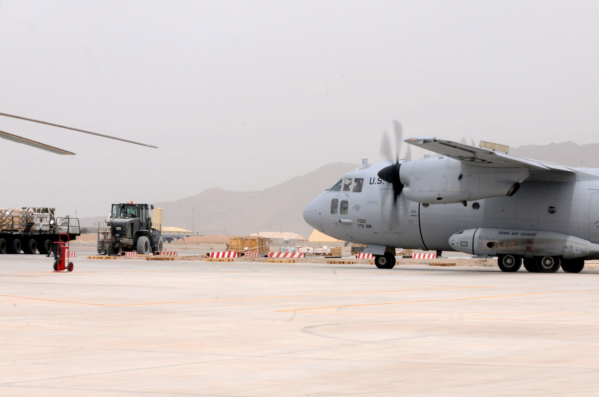 A C-27 Spartan aircraft departs the Kandahar aerial port after picking up passengers that were processed through a security checkpoint by an all Afghan air force aerial port crew, Kandahar Air Wing, April 18, 2012. Advisers from the 738th Air Expeditionary Advisory Group air transportation section are currently training the AAF to manage all cargo and passengers that flow through the KAW AAF passenger terminal. (U.S. Air Force photo by Staff Sgt. Nadine Y. Barclay)
