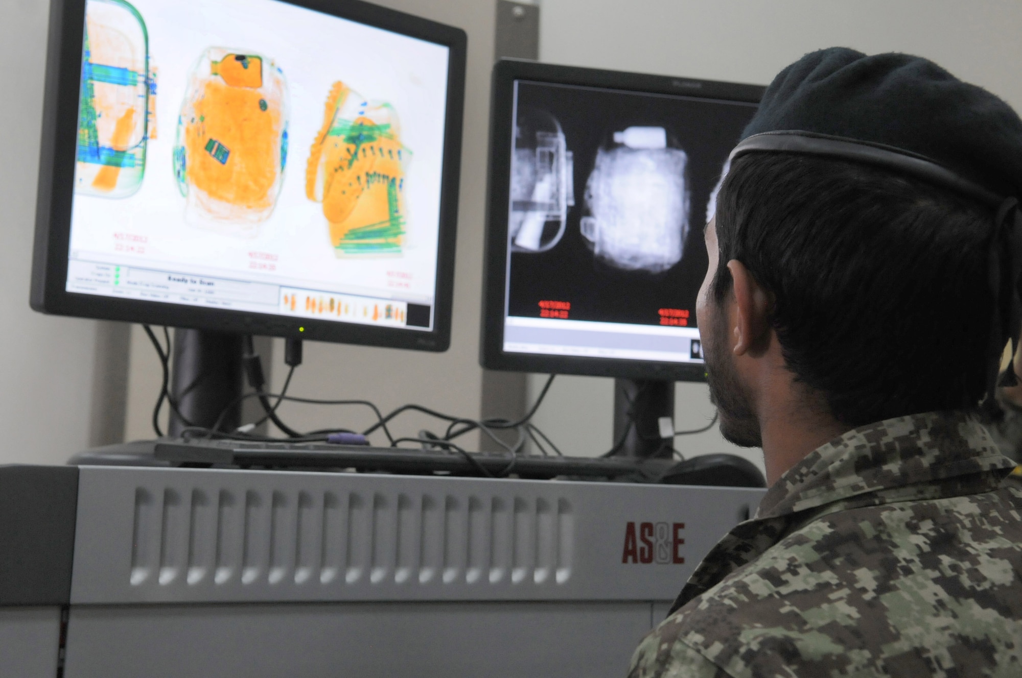 Afghan air force Sgt. Ullah Nasib, aerial port specialist, scans baggage using an X-ray inspection system prior to allowing passengers to enter the AAF passenger terminal at Kandahar Air Wing, Afghanistan, April 18, 2012. Advisers from the 738th Air Expeditionary Advisory Group air transportation section are currently training the AAF to manage all cargo and passengers that flow through the KAW AAF passenger terminal. (U.S. Air Force photo by Staff Sgt. Nadine Y. Barclay)